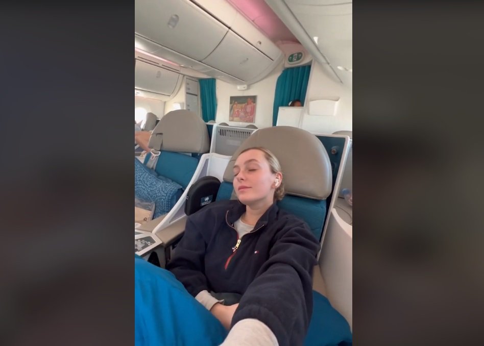 woman flies business leaves baby in economy